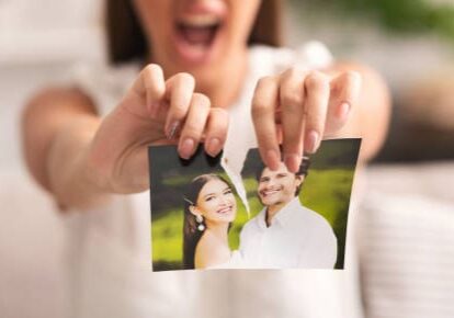 Divorce Concept. Unrecognizable Furious Girl Tearing Apart Photo Of Happy Couple Indoor. Selective Focus, Panorama, Cropped